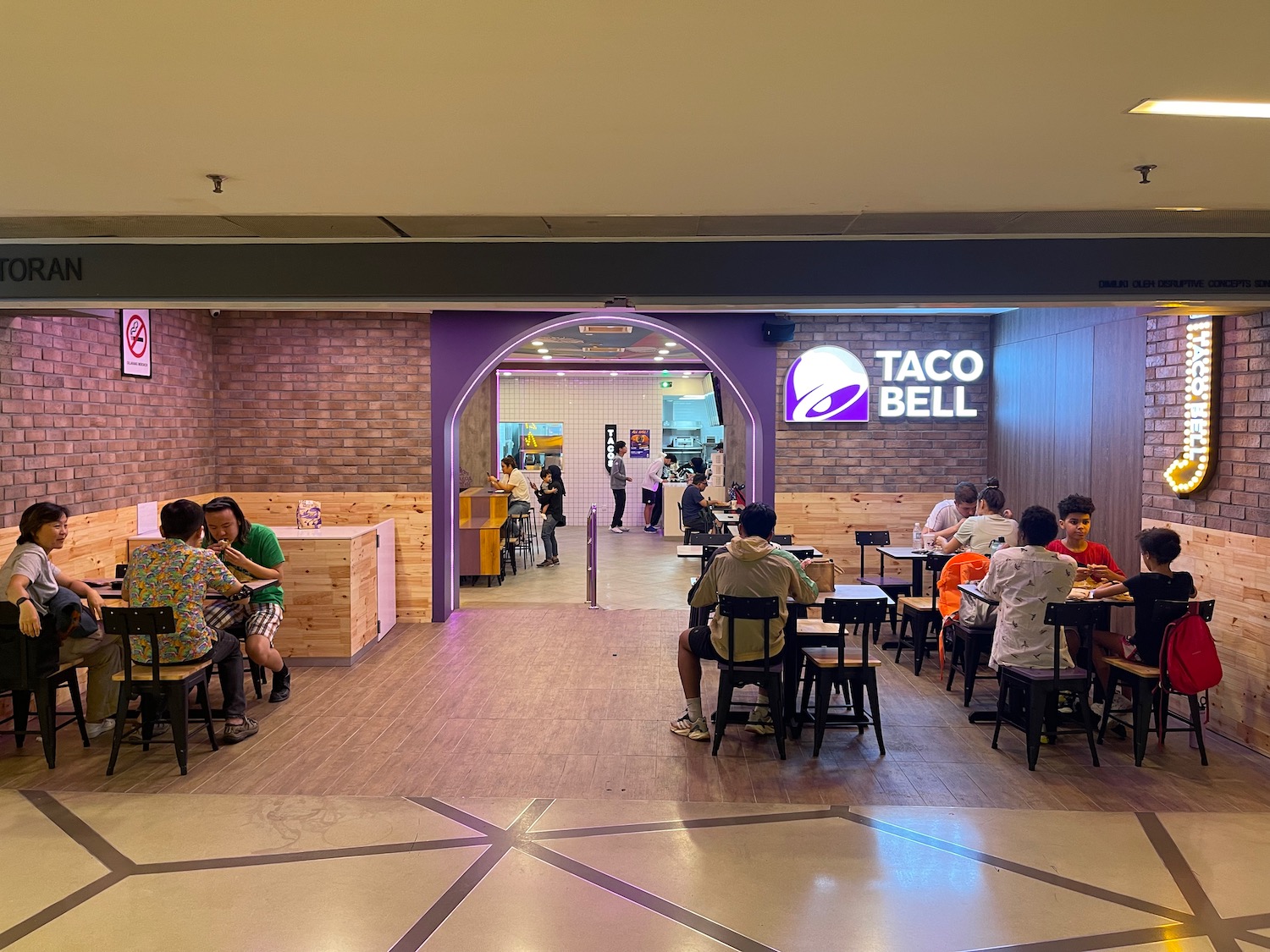 people sitting at tables in a restaurant