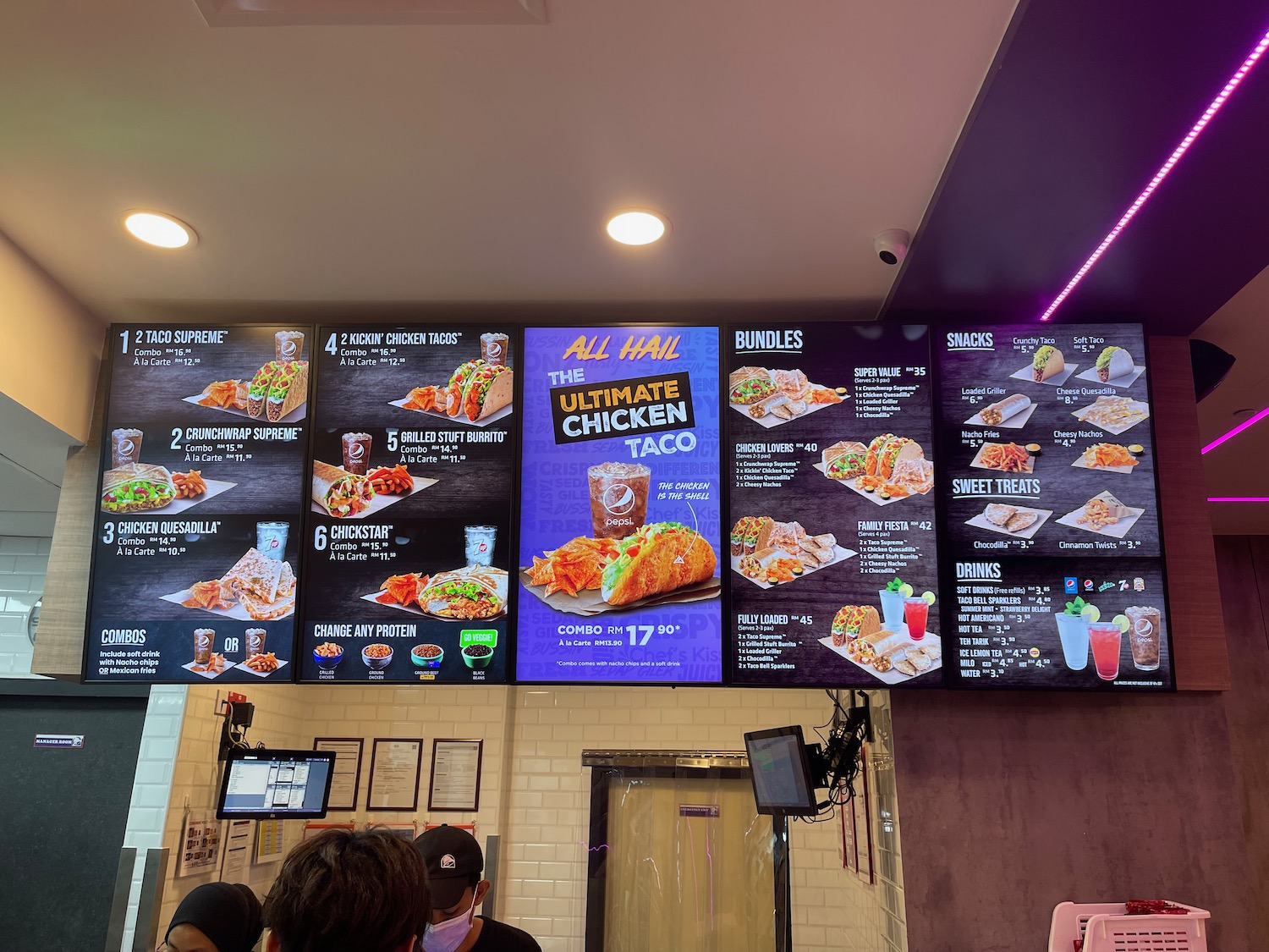 a menu board with images of food on it