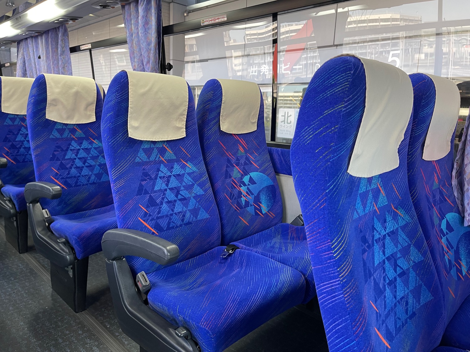 a blue seats on a bus