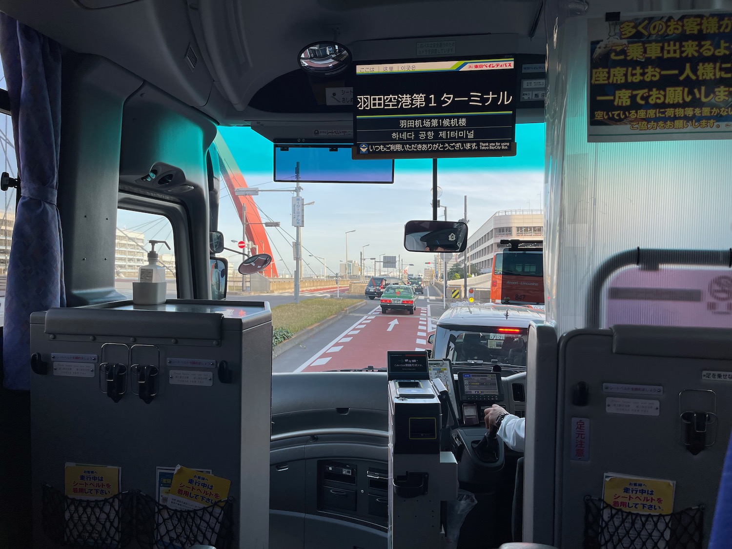 inside a bus with a driver's seat and a screen