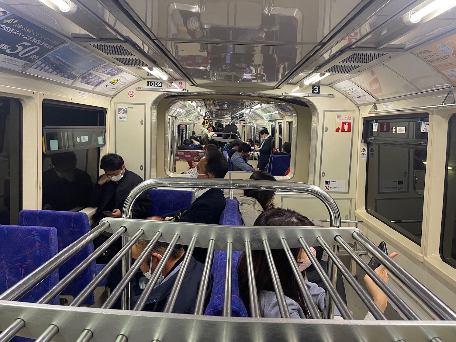 a group of people sitting on a train