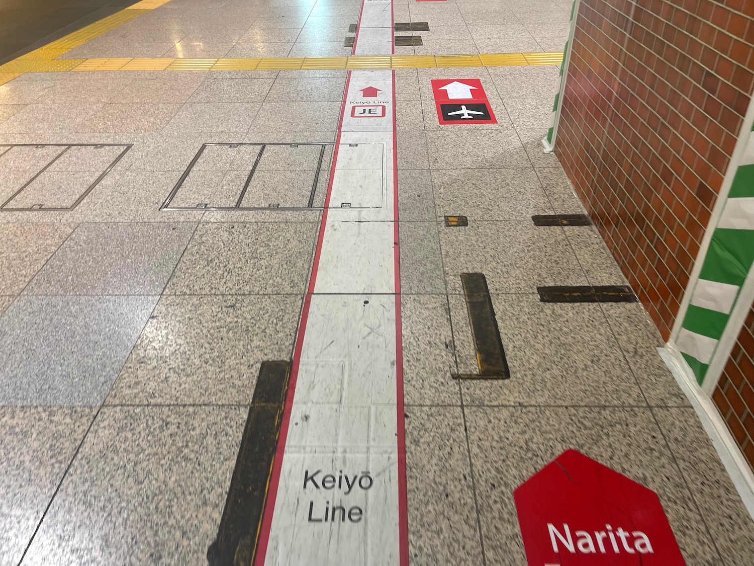 a line of signs on a tile floor