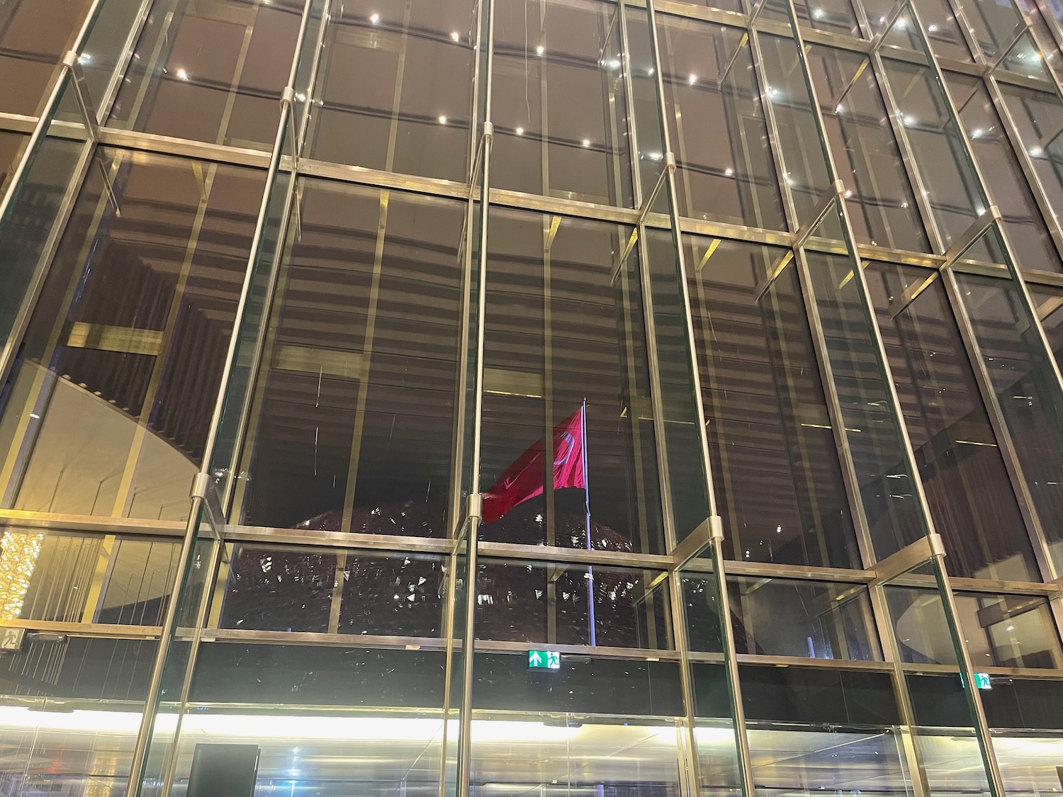 a glass wall with a flag on it