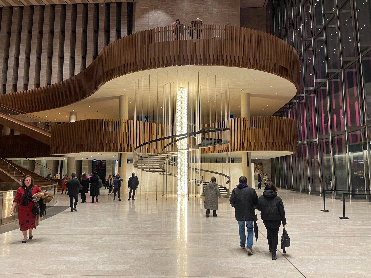 a group of people walking in a large building