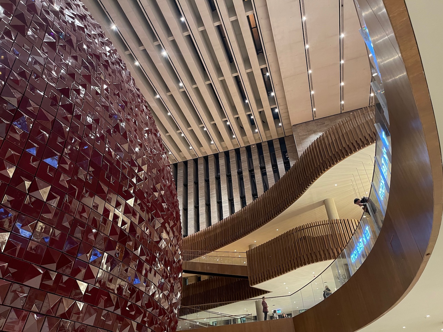 a large red sphere in a building