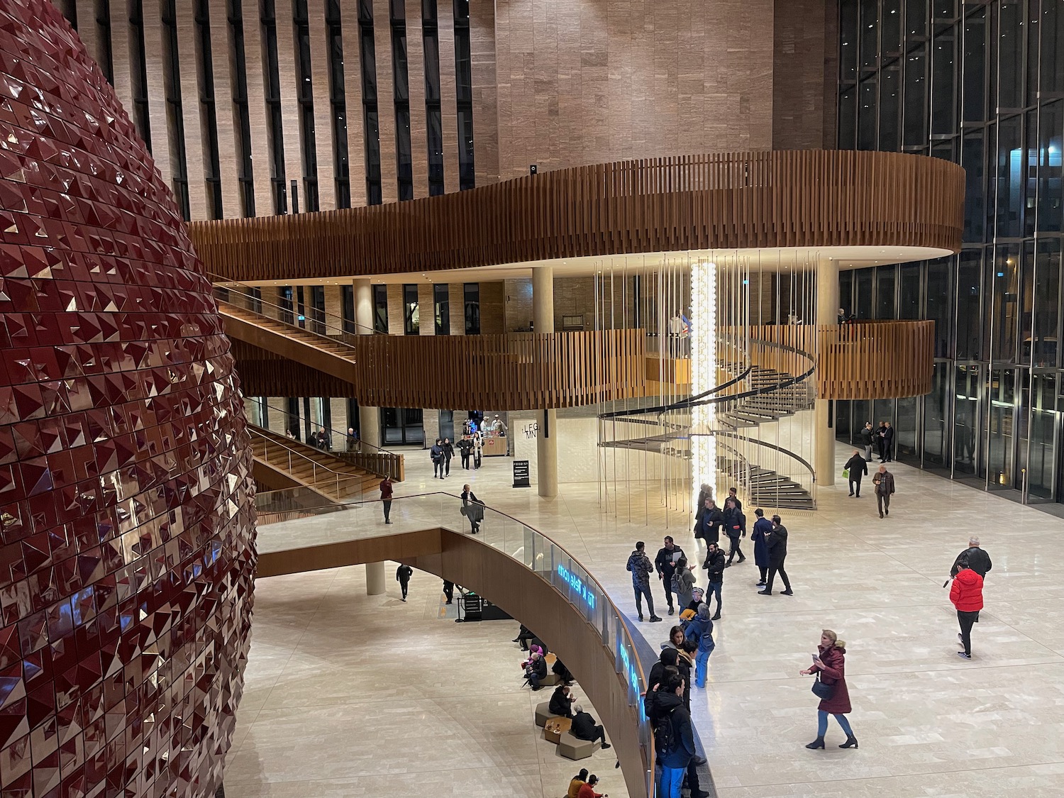 a large building with a large red sphere in it