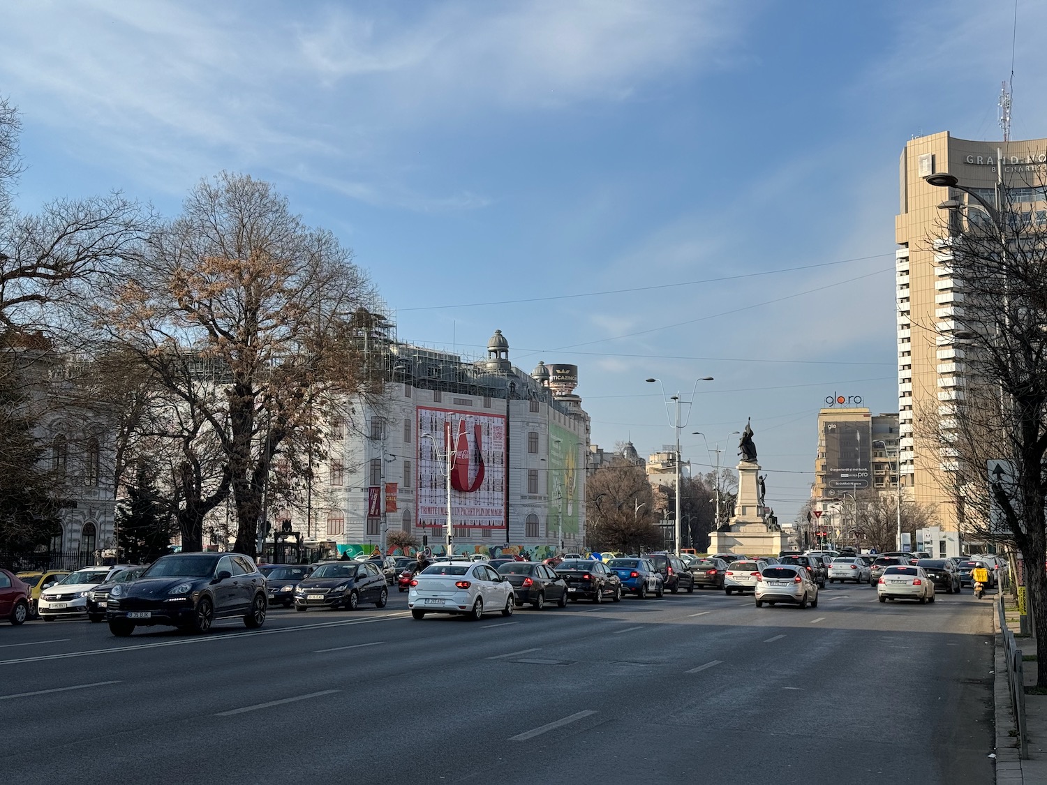 a street with cars and buildings