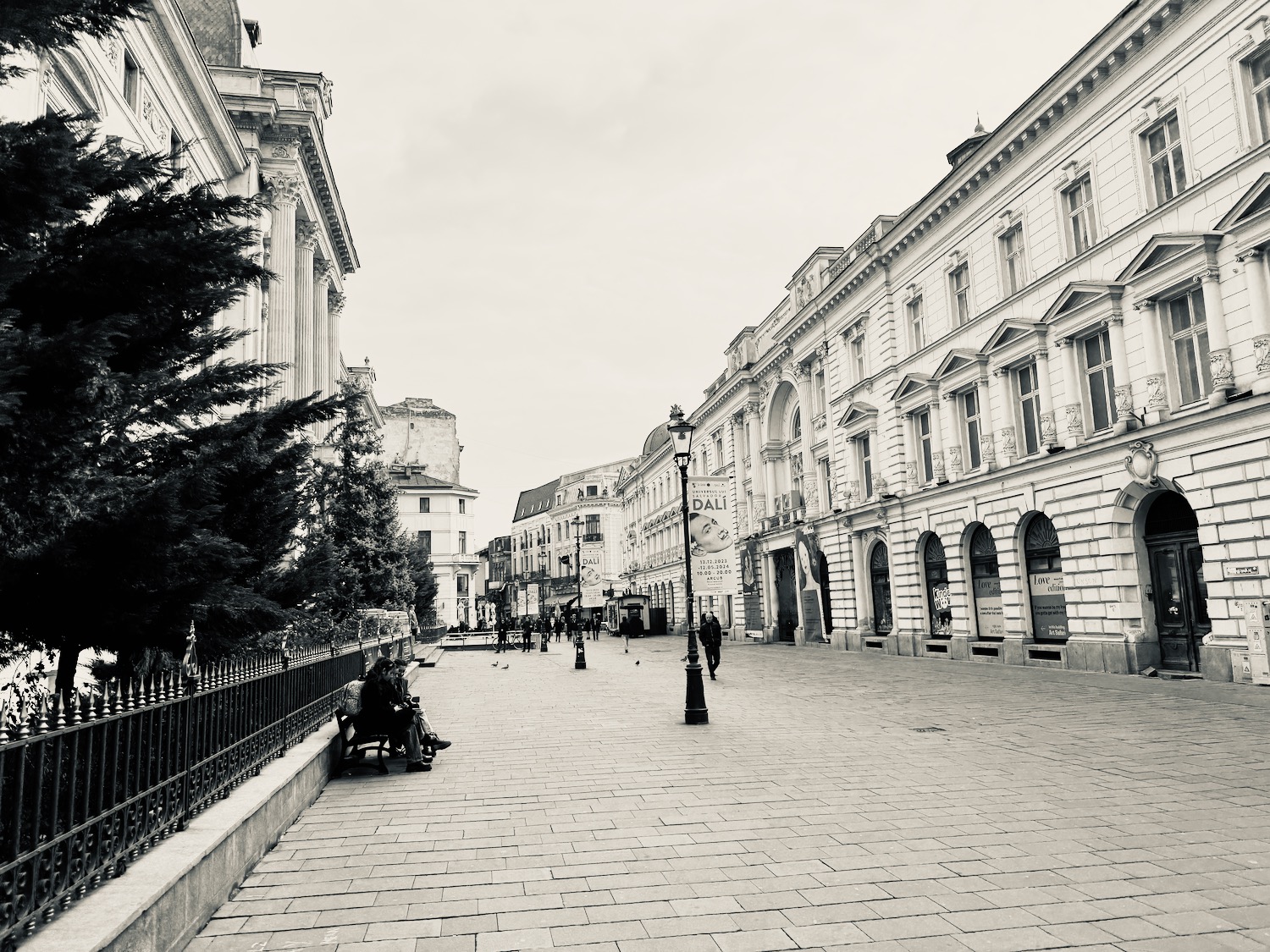 a street with buildings and people