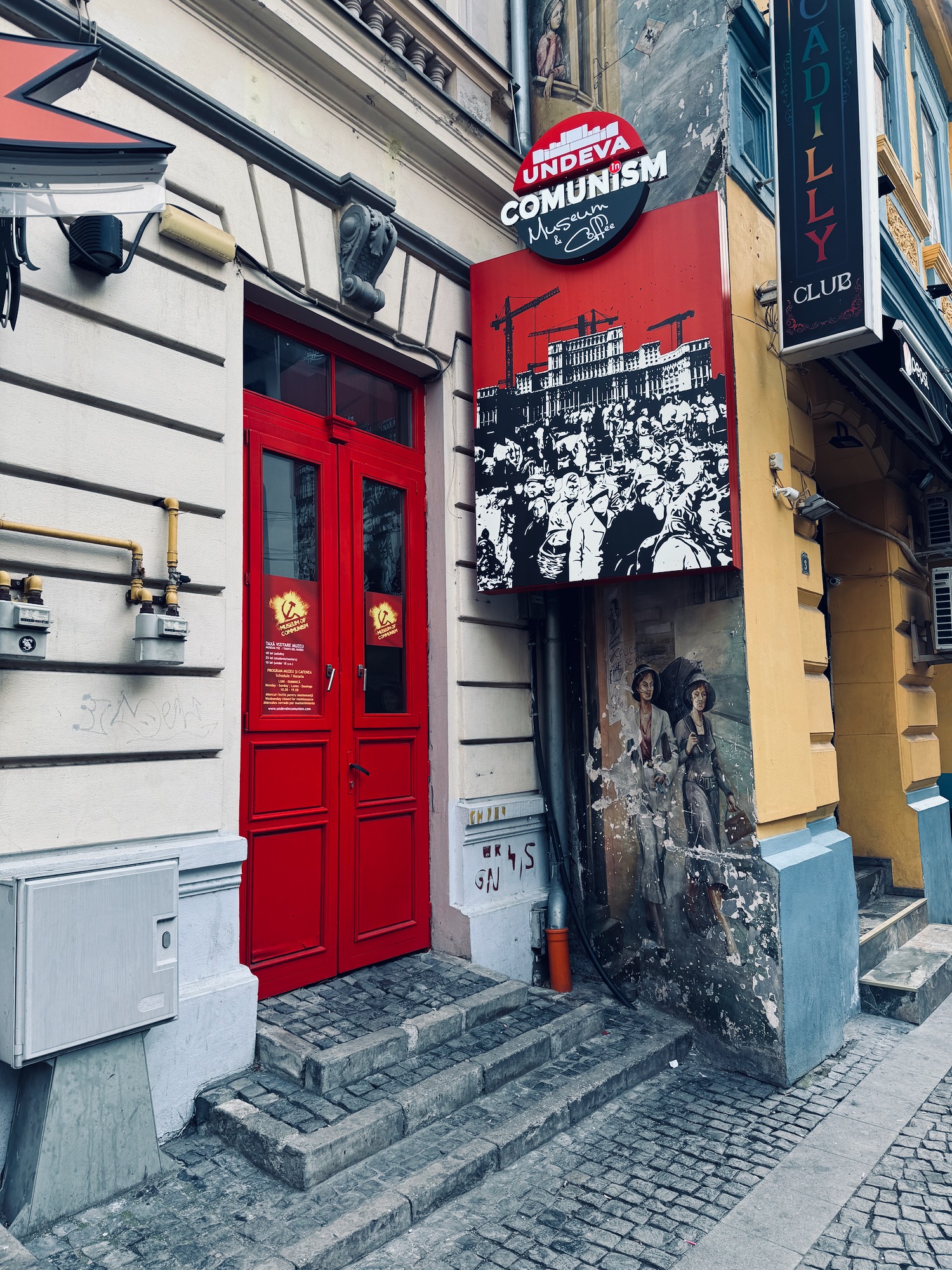 a red door with a sign on it