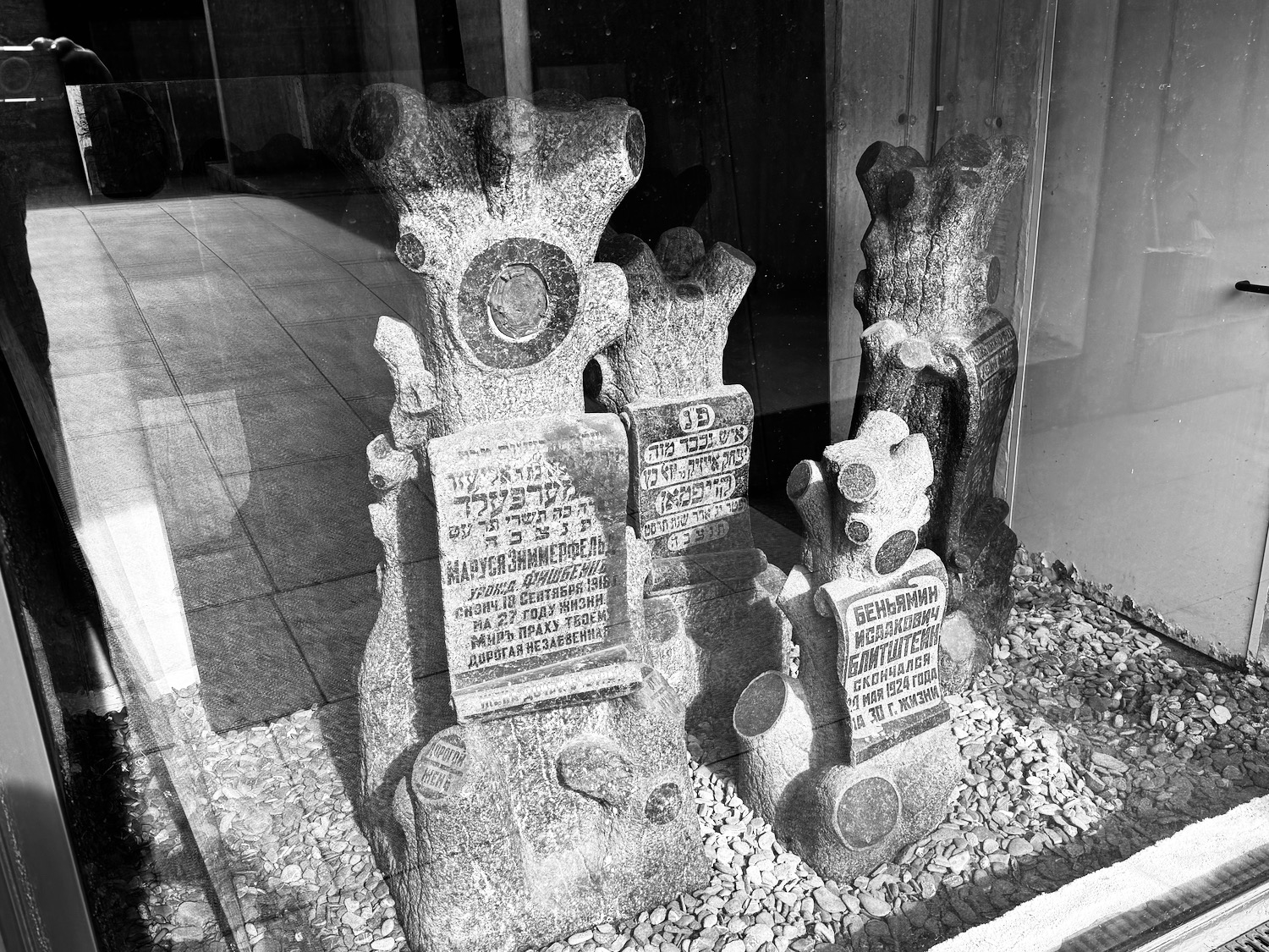 a group of tombstones in a window