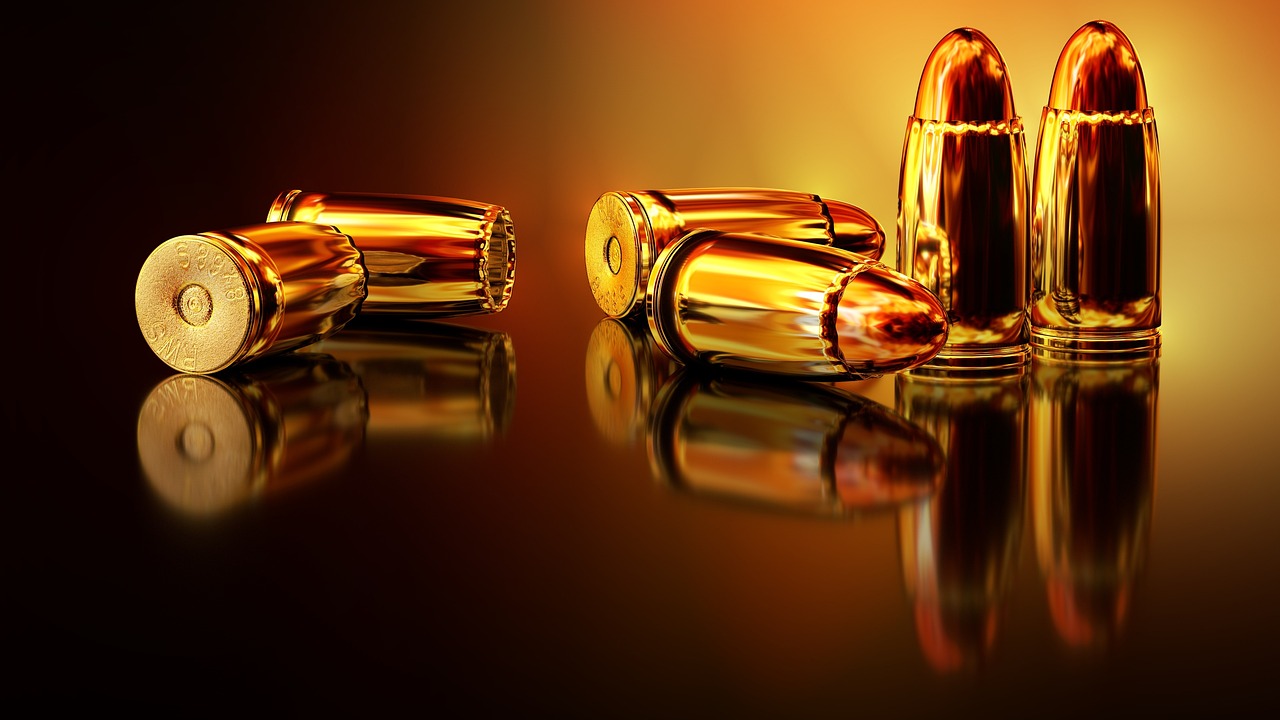 a group of bullets on a reflective surface