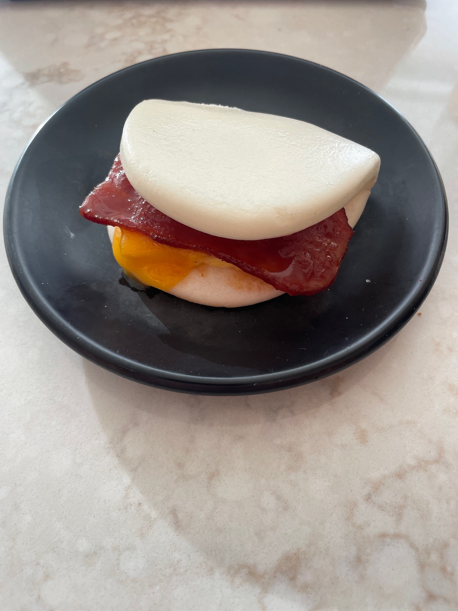 a sandwich on a black plate