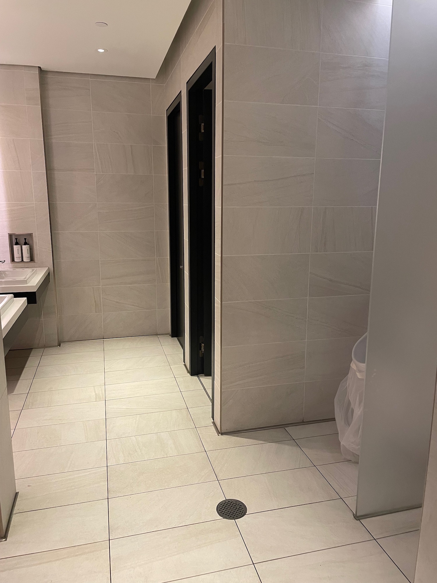 a bathroom with a shower stall and sink