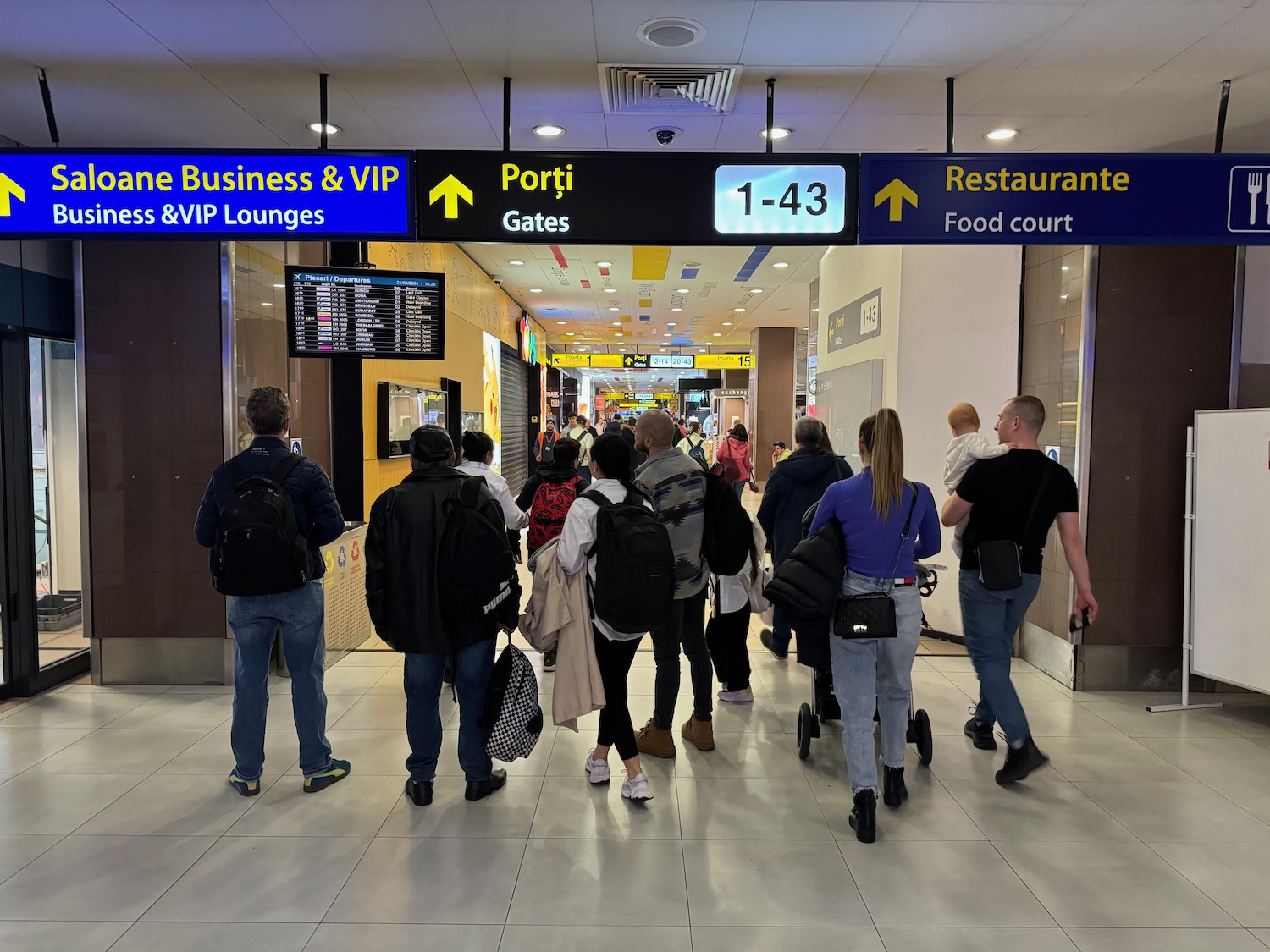 a group of people walking in a building