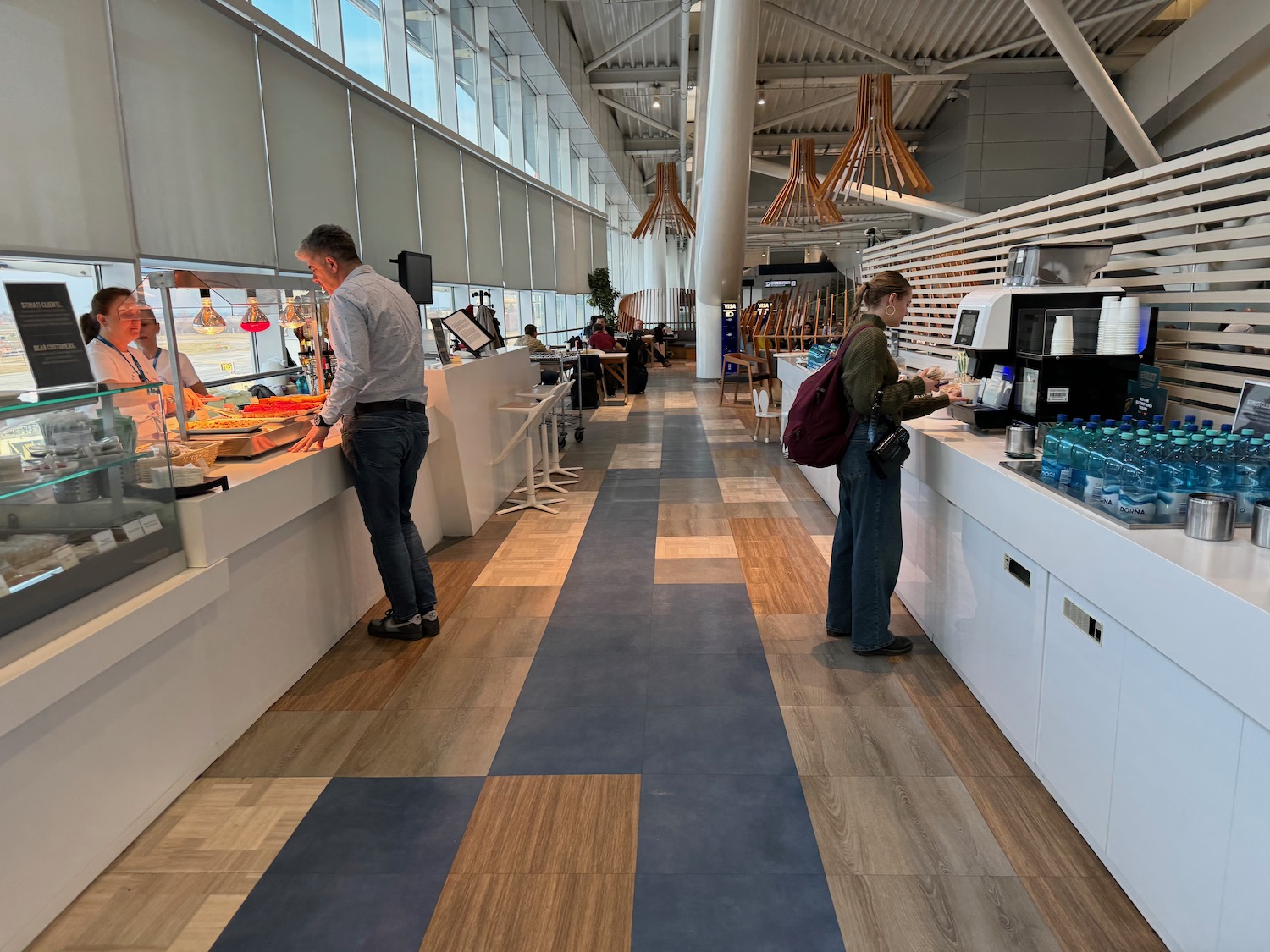 people standing in a cafeteria