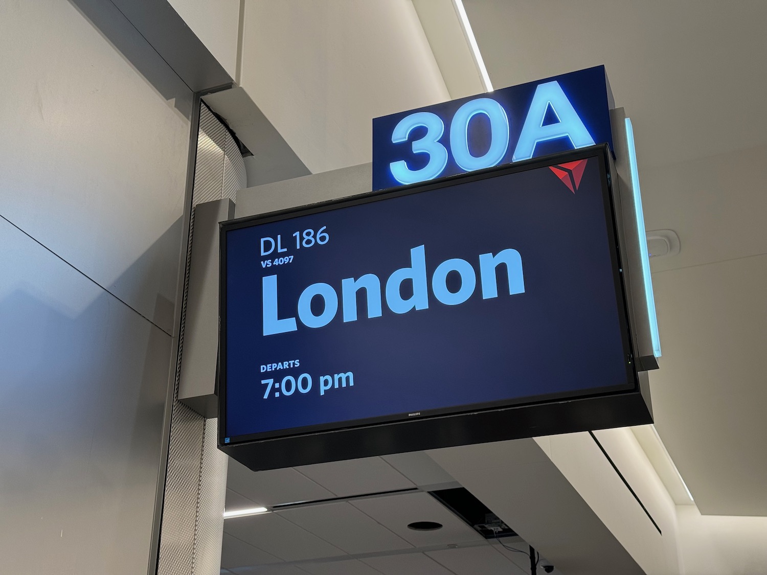 a sign with a blue and white text