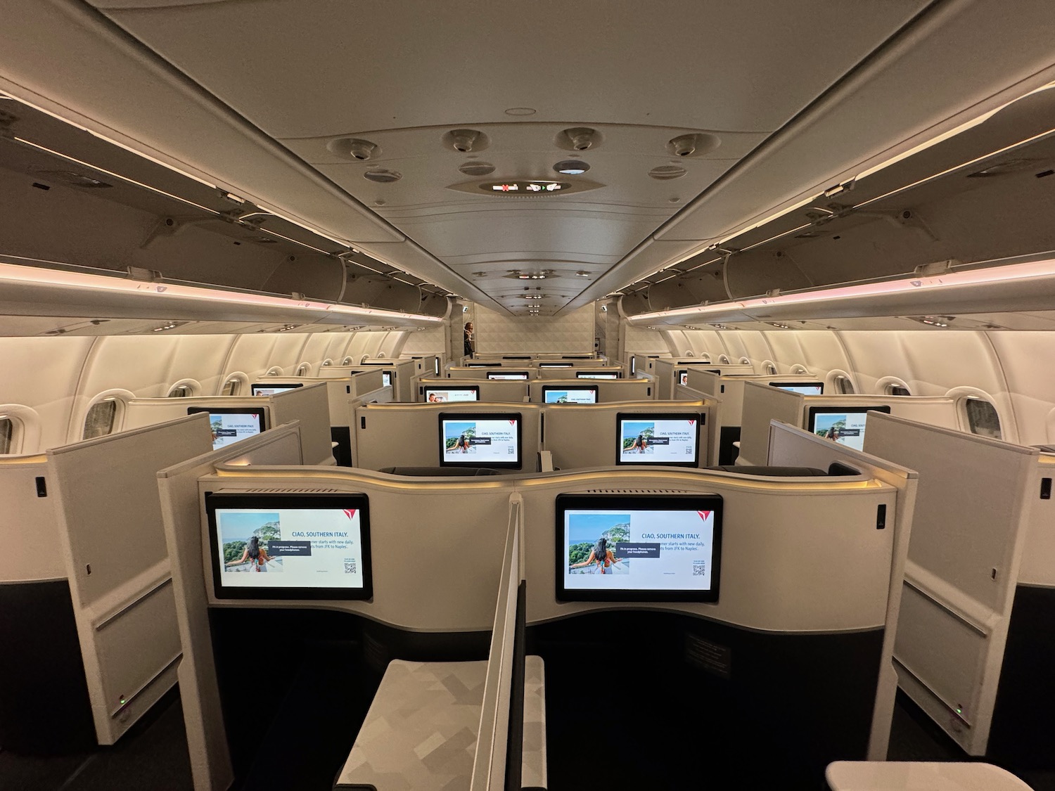 a row of monitors in an airplane