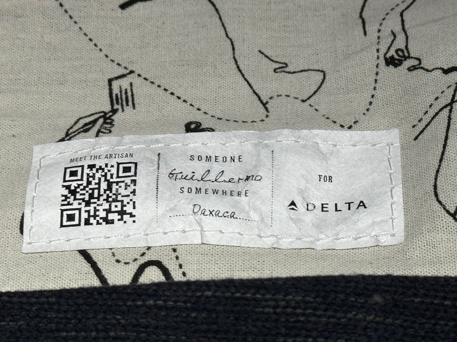 a white label with a qr code on it