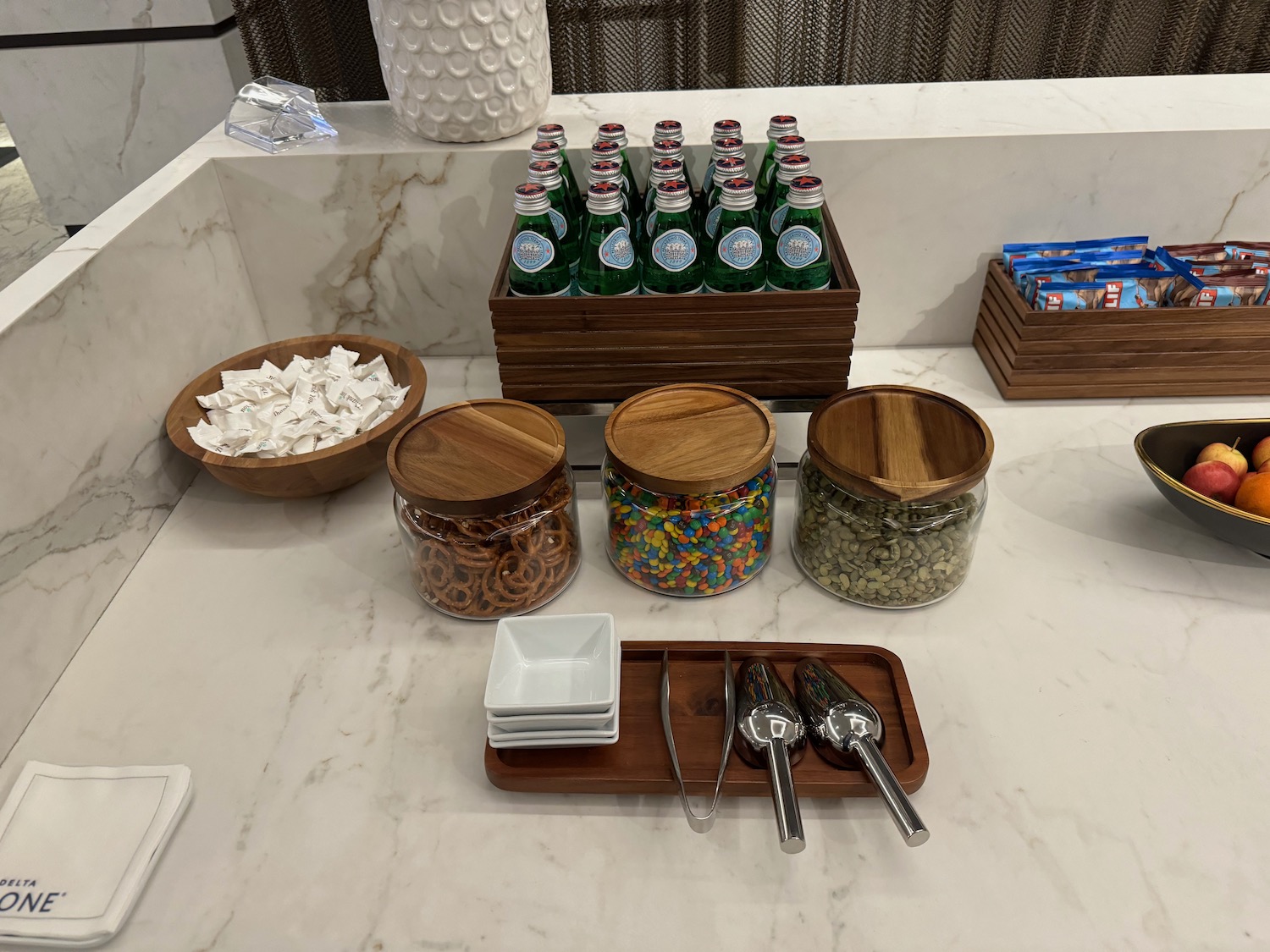 a table with different containers and bottles of soda