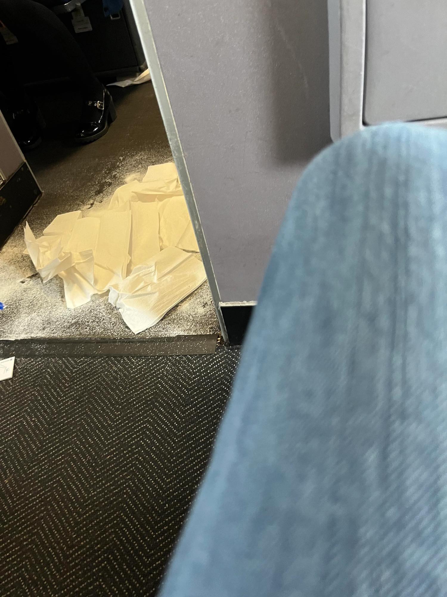 a pile of white paper towels on the floor