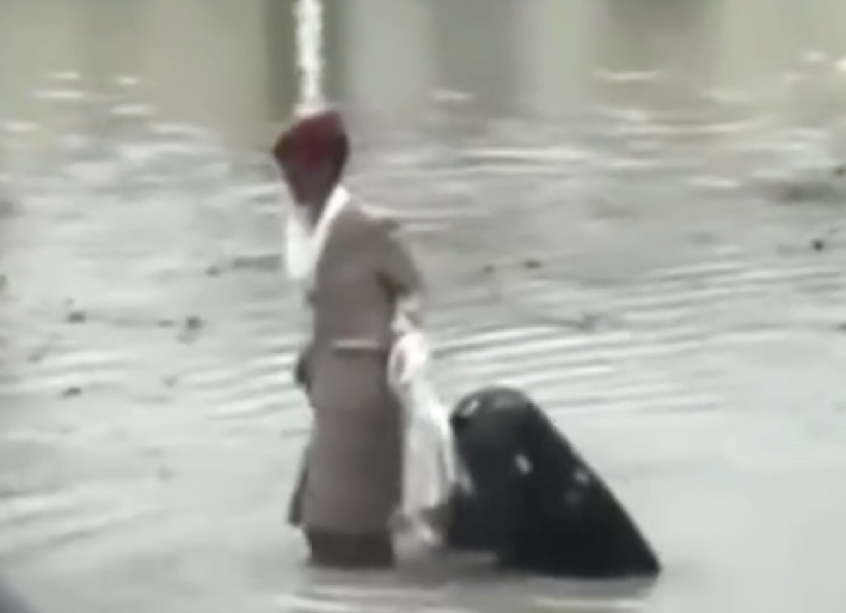 a person in a suit standing in water