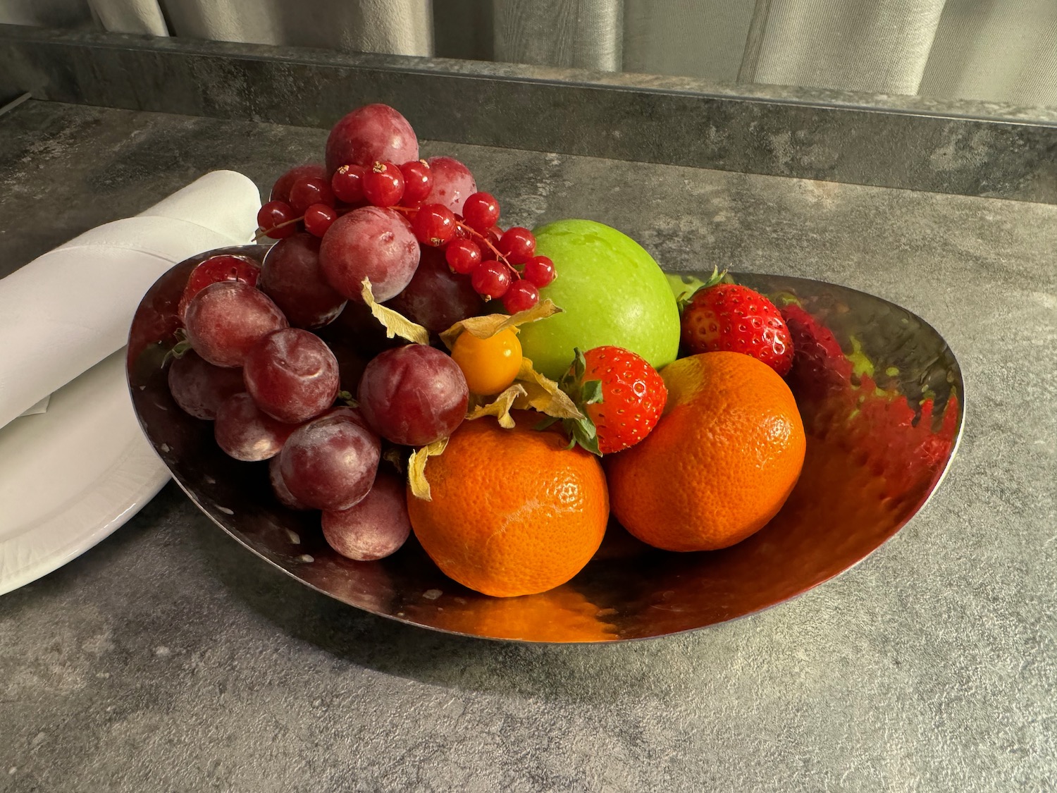 a bowl of fruit on a table