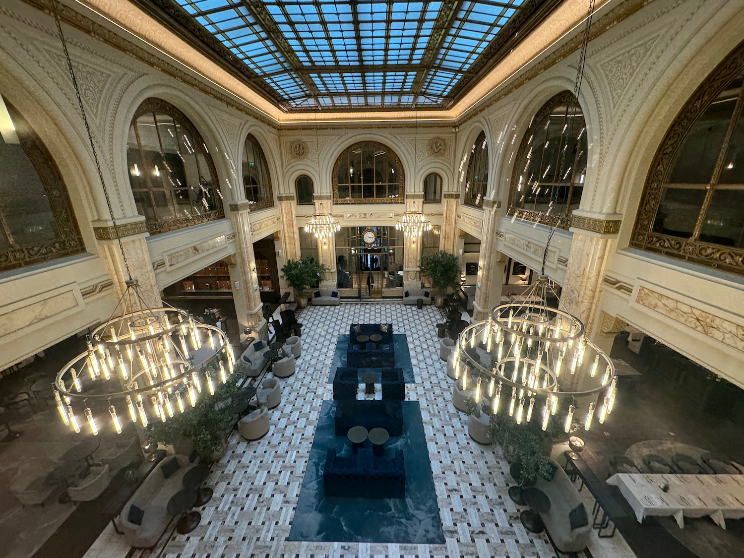 a large room with chandeliers and tables