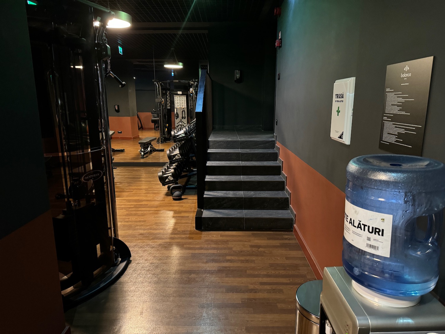 a gym with stairs and treadmills