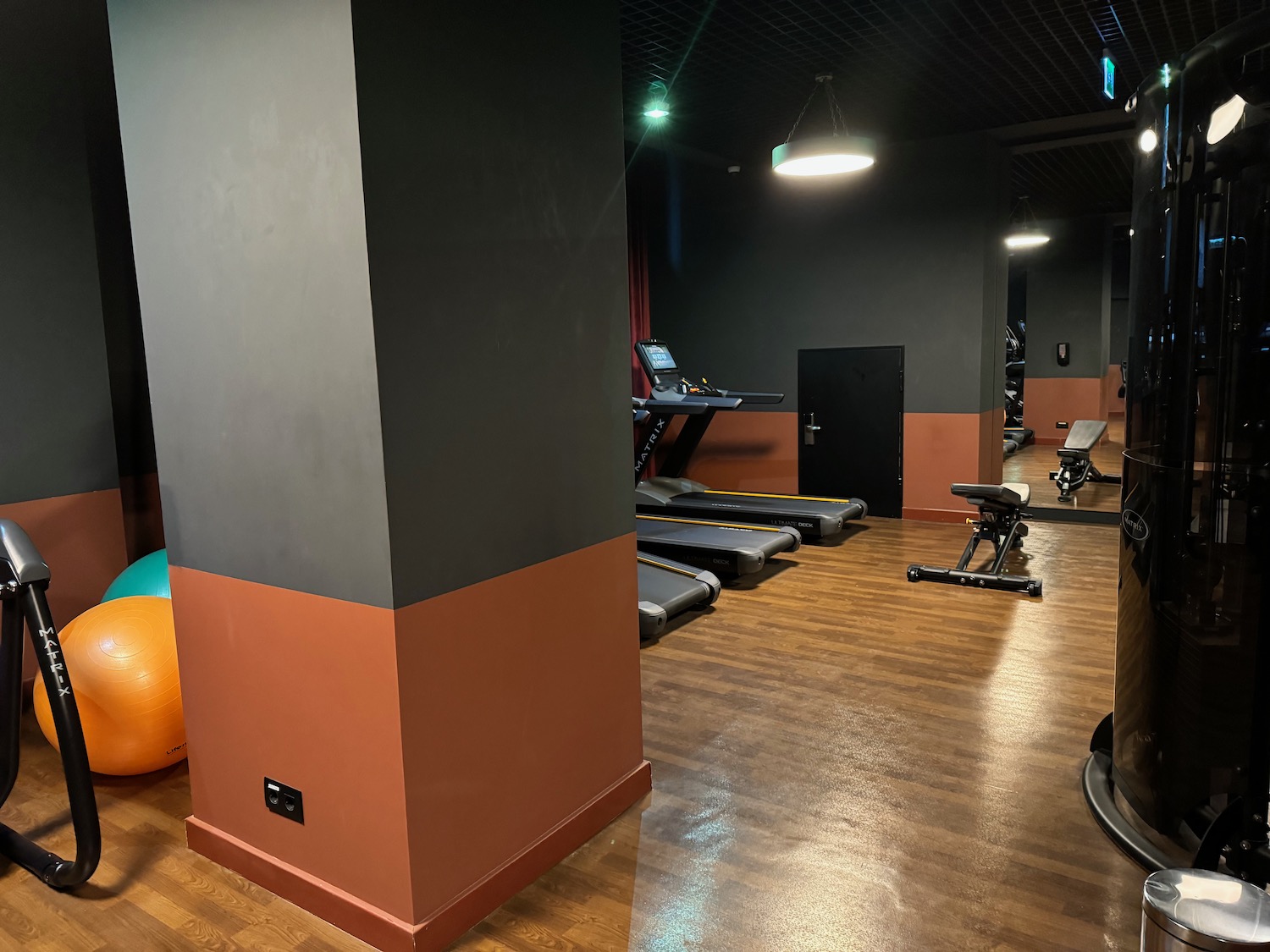 a gym with treadmills and exercise equipment