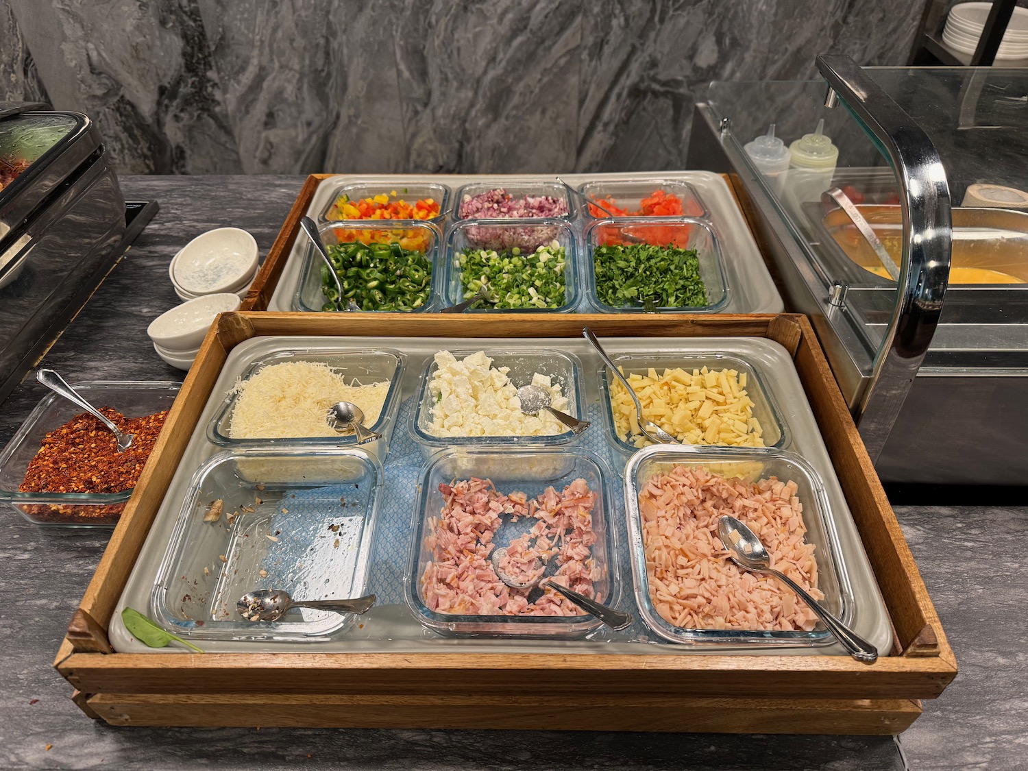 a trays of food in a buffet