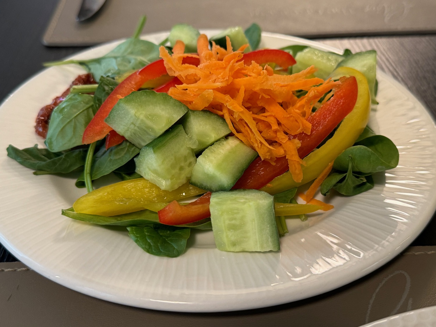 a plate of salad with vegetables