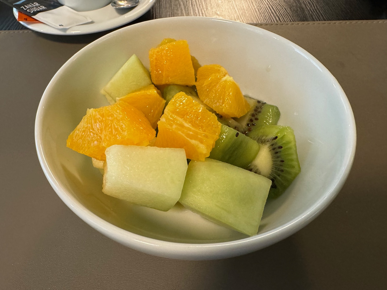a bowl of fruit on a table