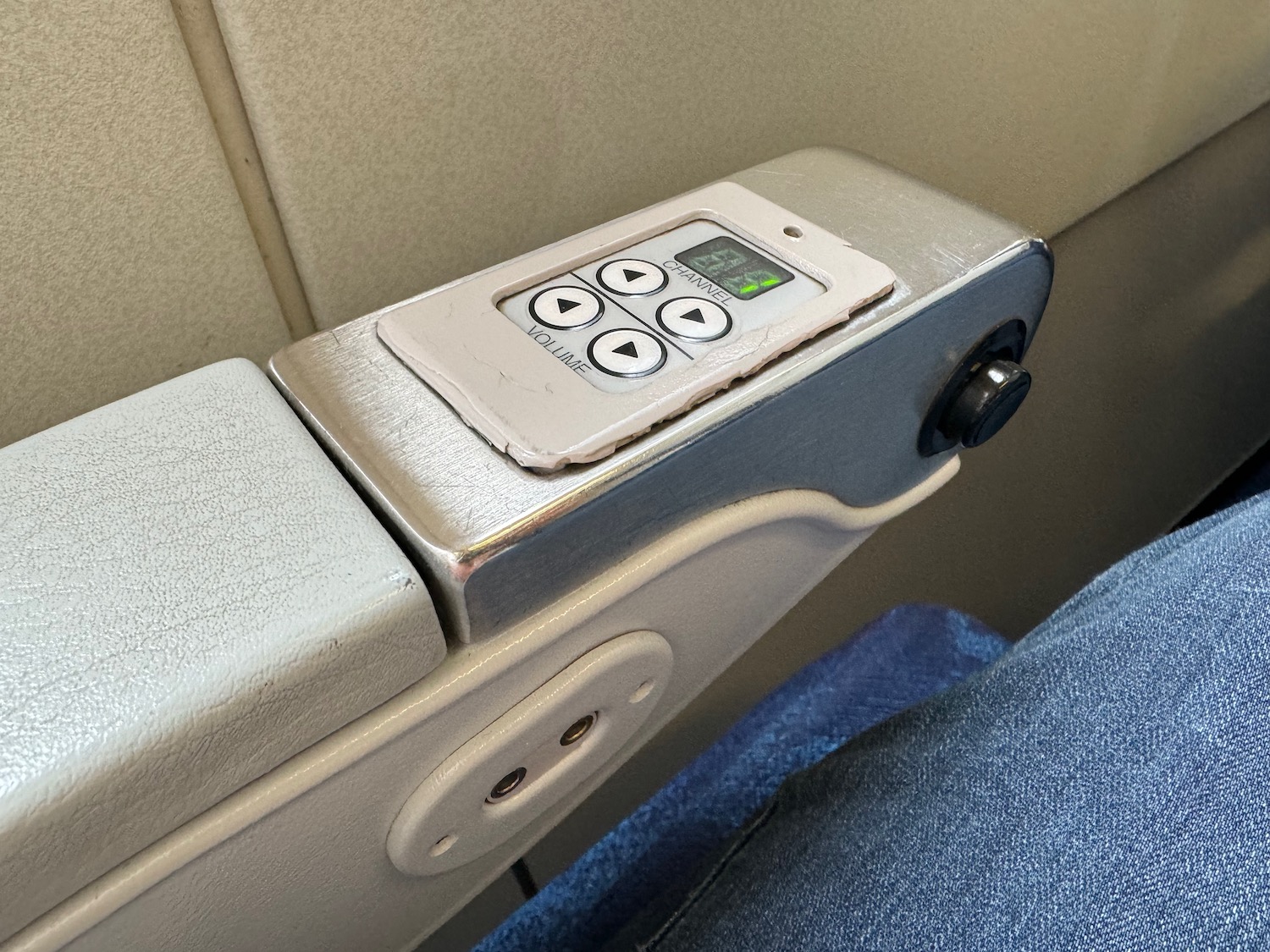 a seat arm rest with buttons and buttons