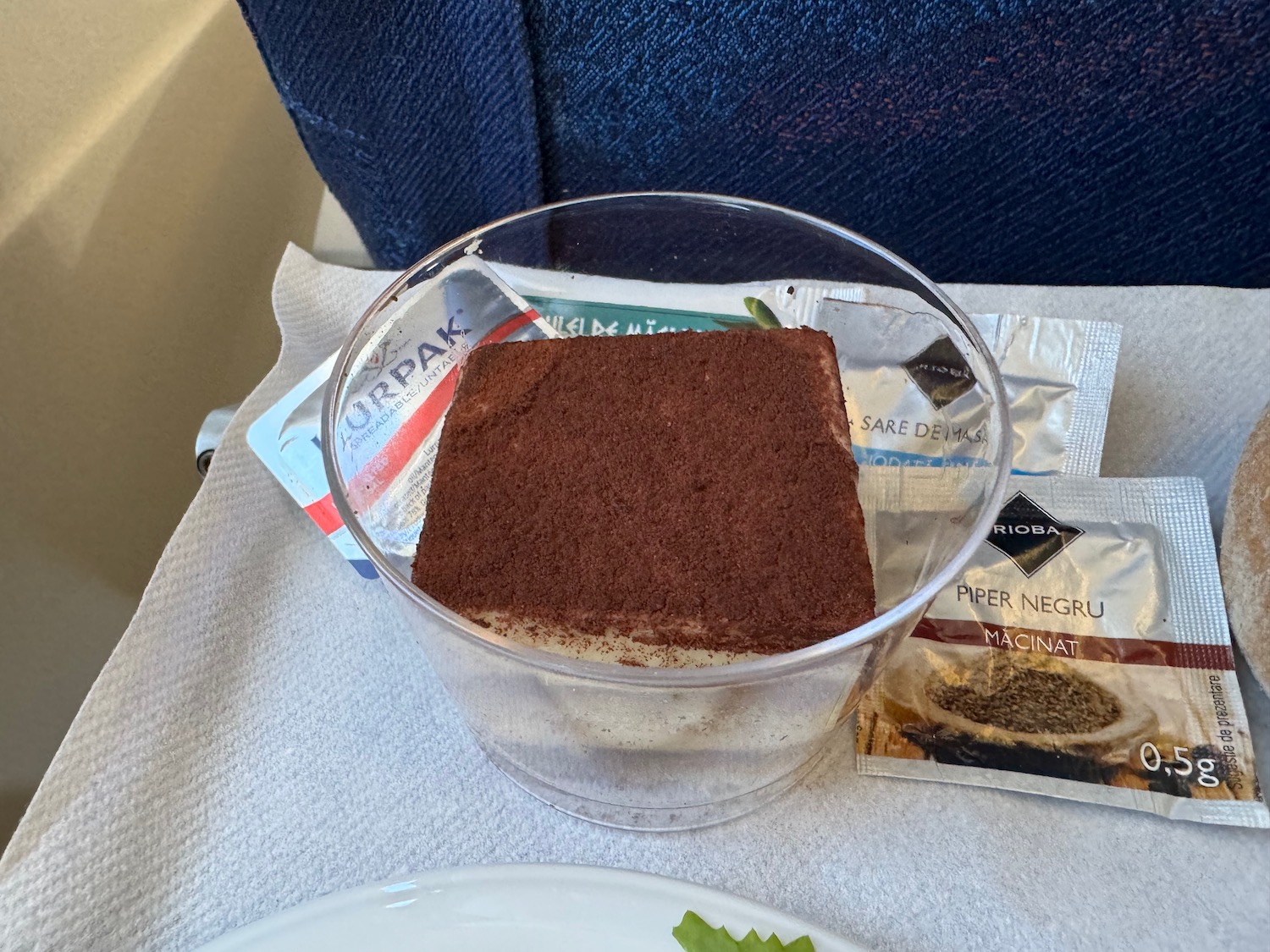 a square piece of food in a glass container