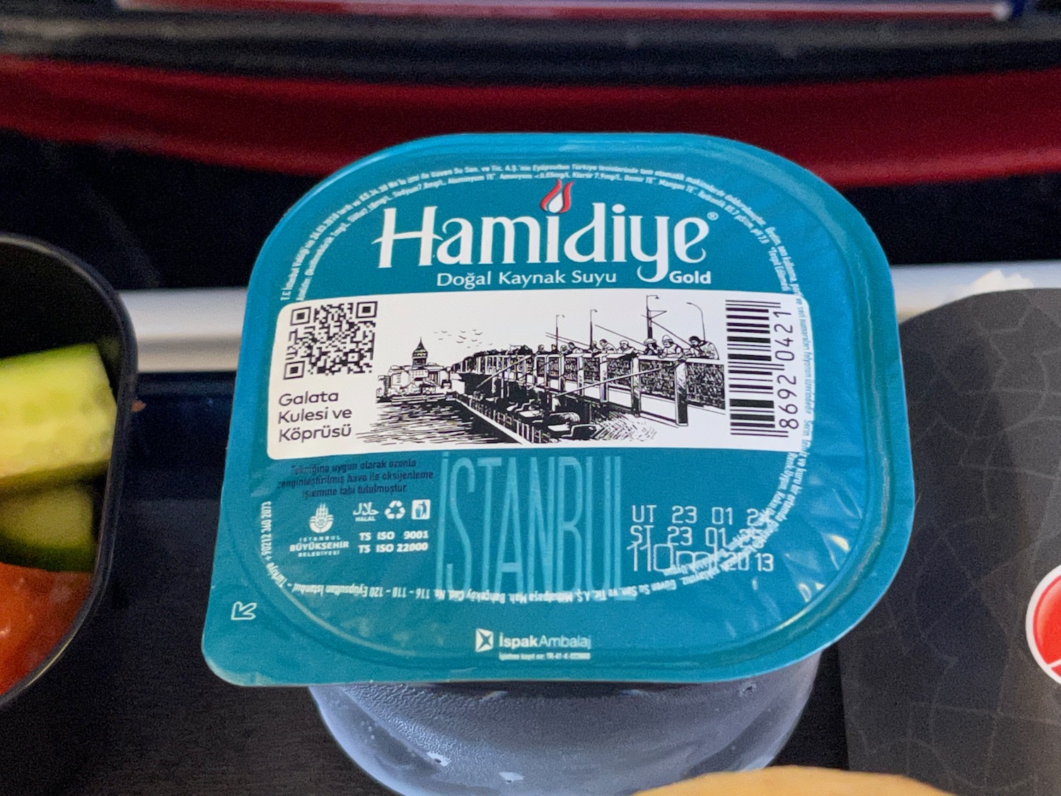 a plastic container with a blue lid