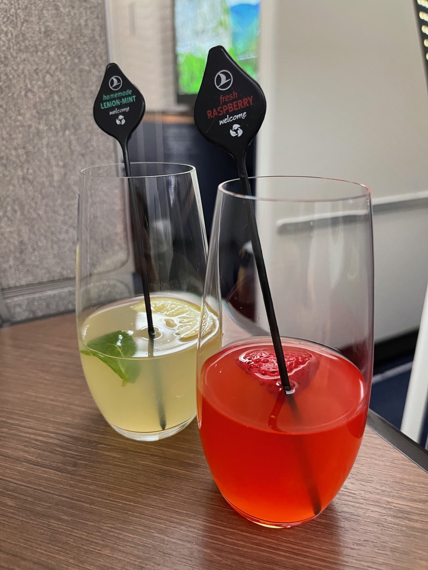 two glasses with different colored drinks