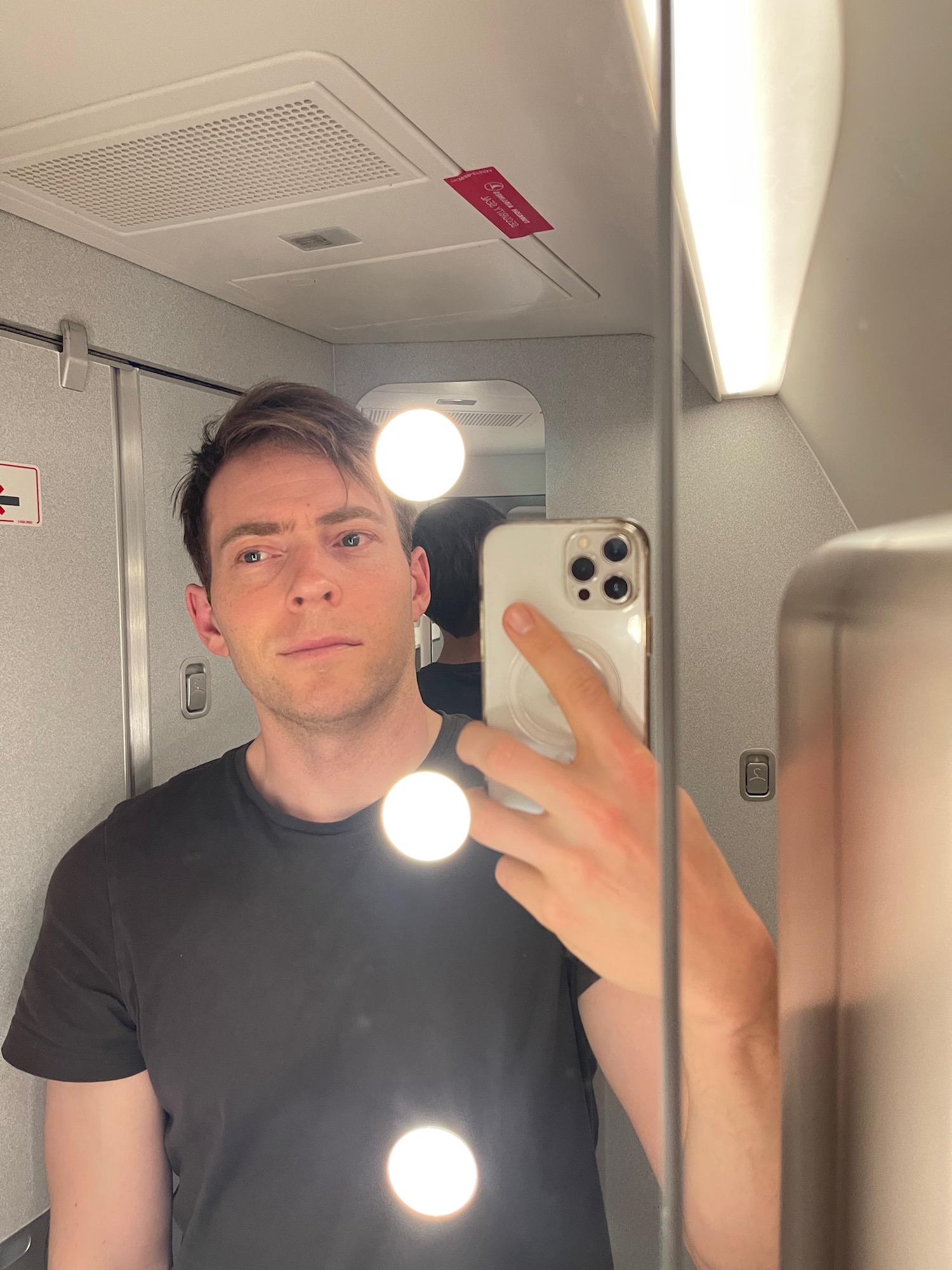 a man taking a selfie in a mirror
