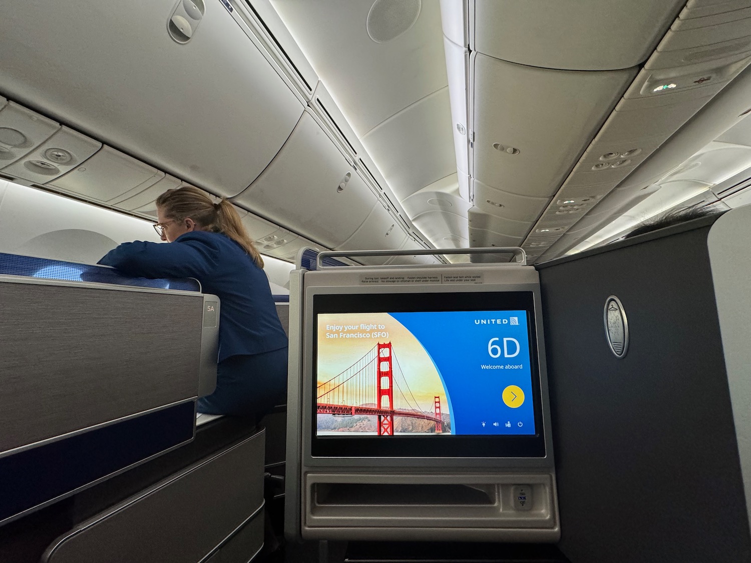 a woman sitting in an airplane