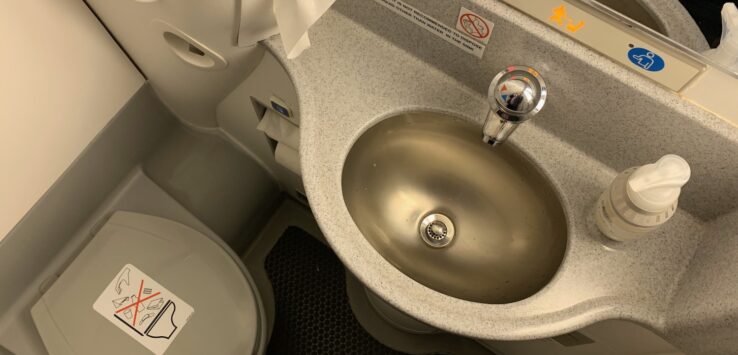 a sink and toilet in a plane