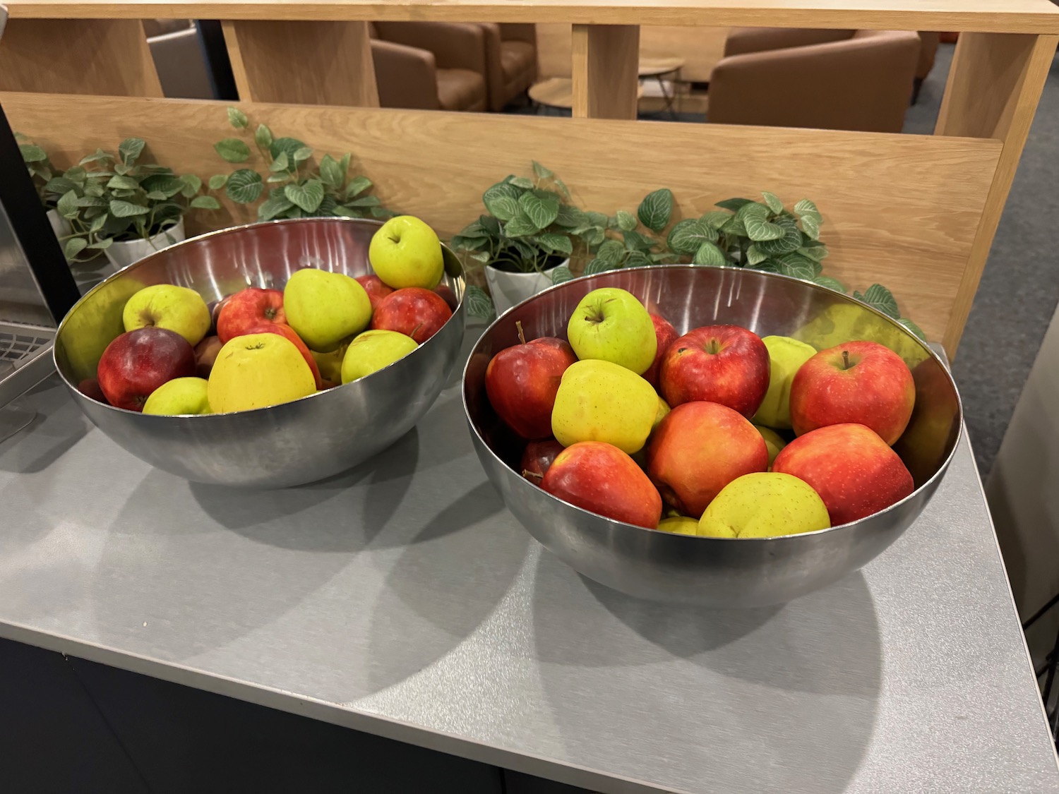a bowl of apples on a counter