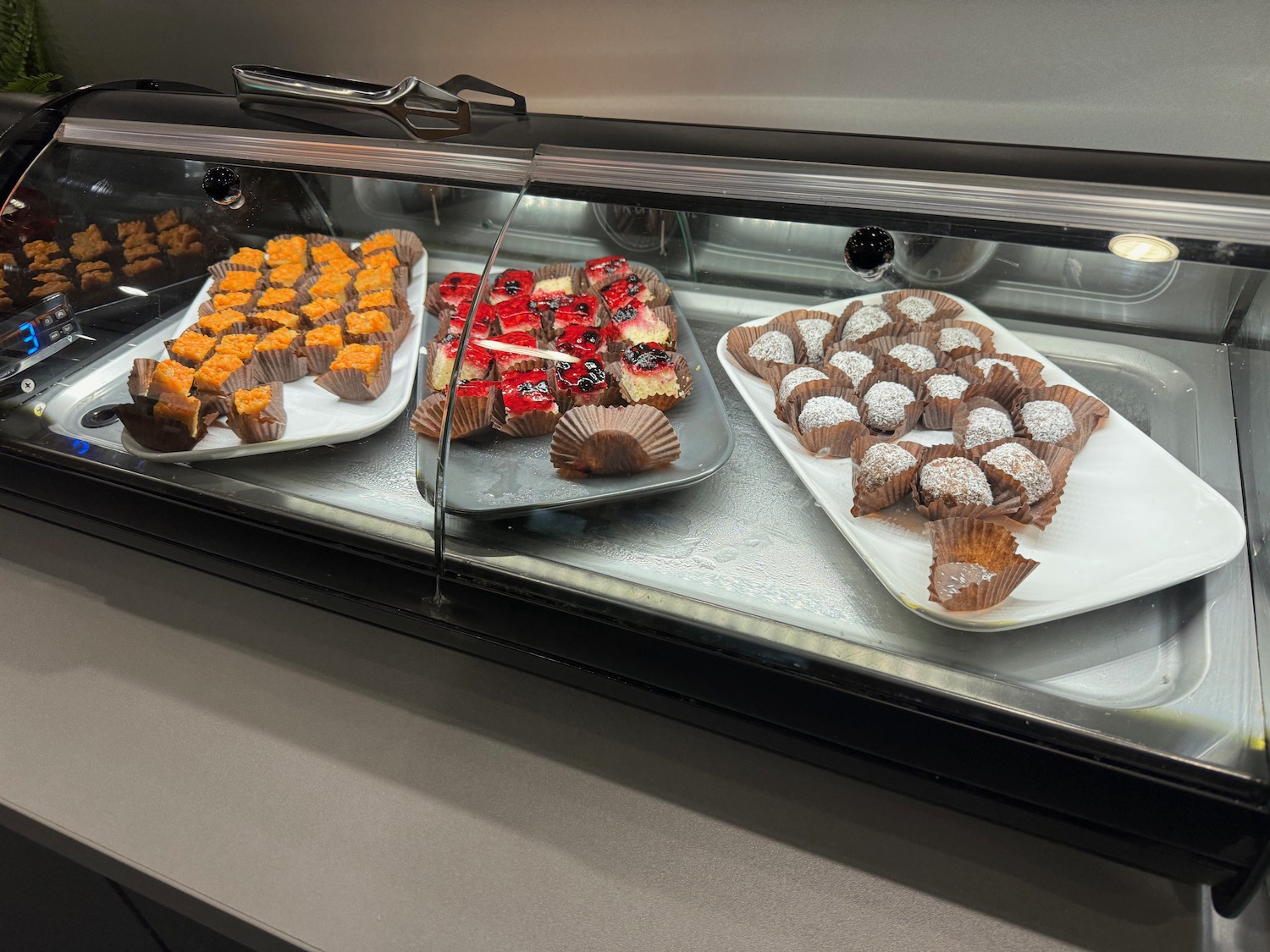 a display case with different types of desserts