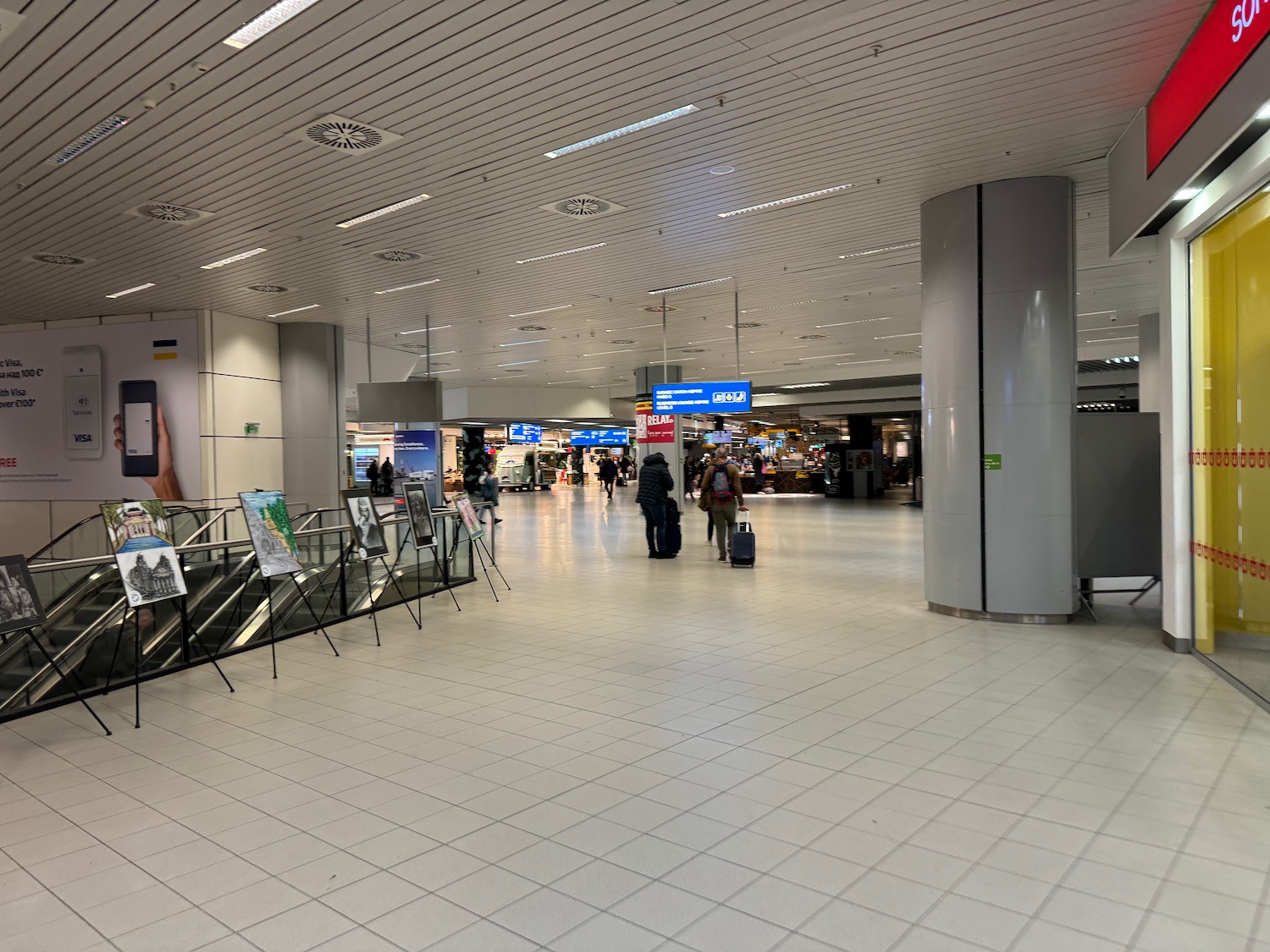 people walking in a large airport