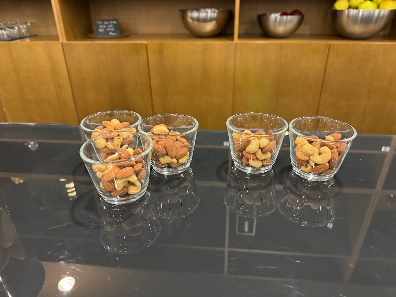 a group of glasses filled with nuts