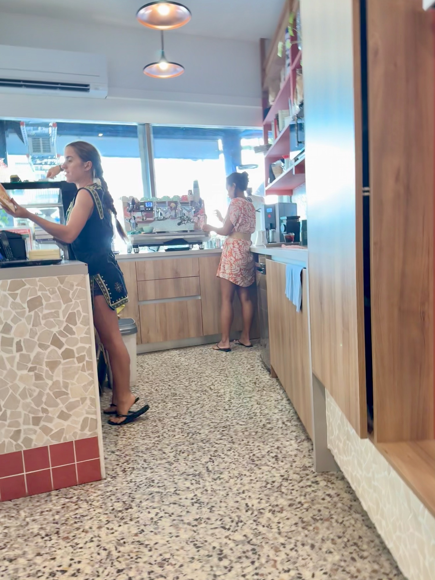 a group of women standing in a kitchen