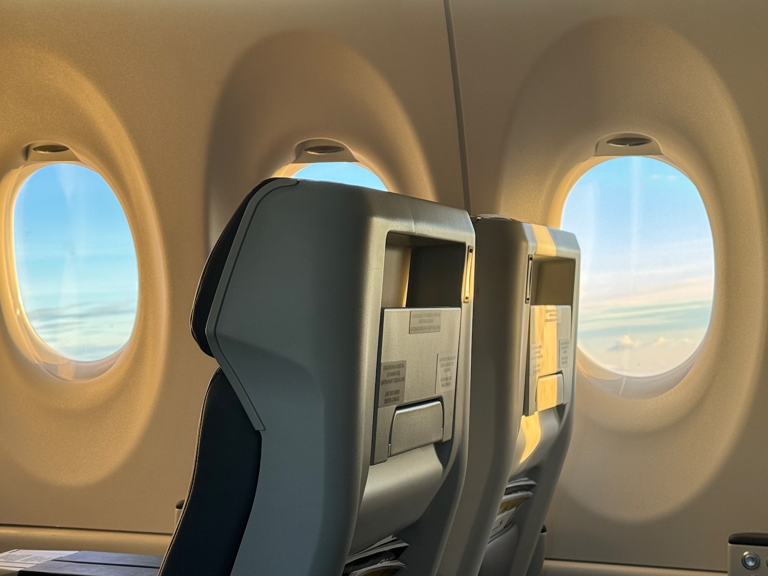 seats in an airplane with windows