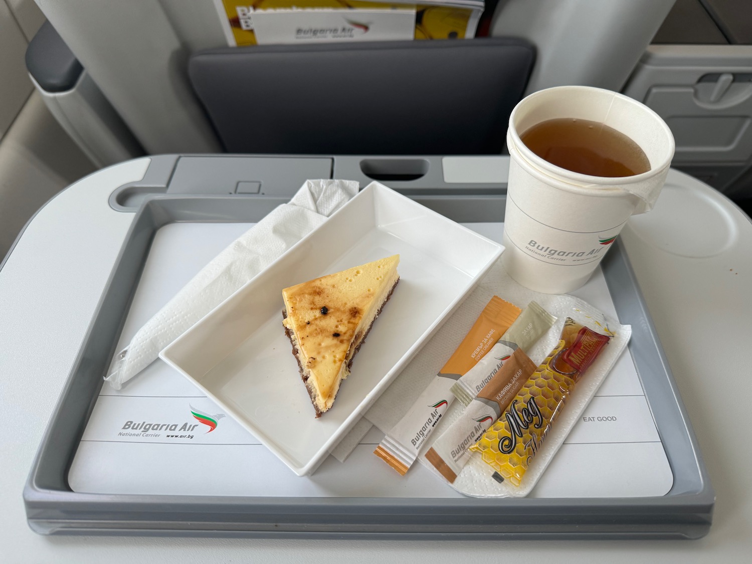 a tray with food and a cup of tea on it