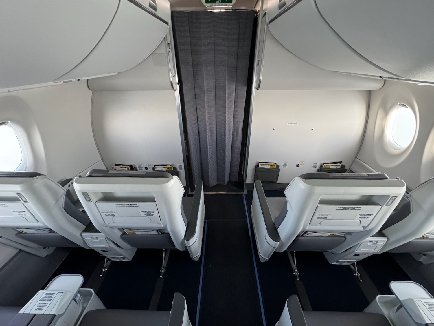 a plane with seats and a curtain