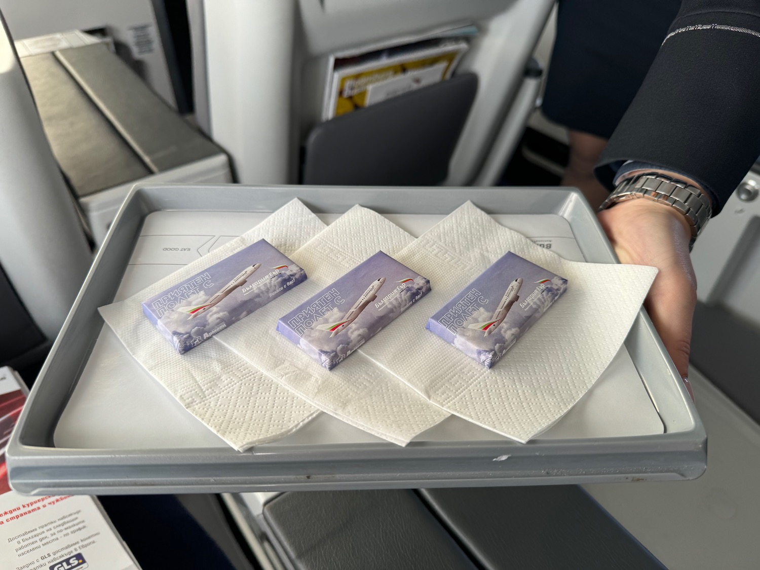 a tray with napkins and small rectangular objects on it