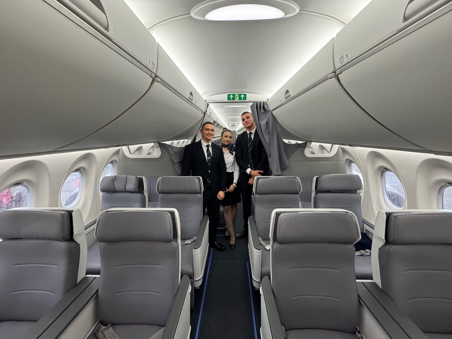 a group of people standing in an airplane