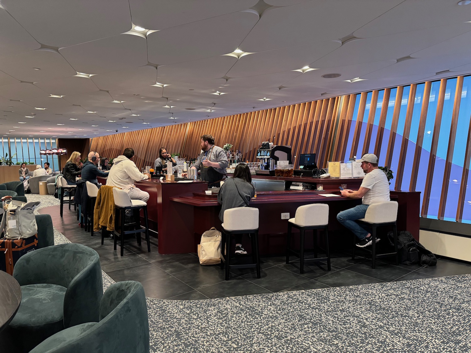 a group of people sitting at a bar